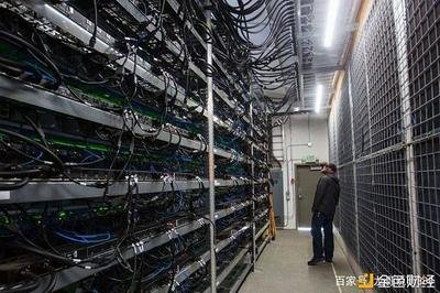 Aerial view of a large-scale Bitcoin mining farm, showing rows of mining rigs and cooling infrastructure.