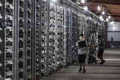 A bustling mining farm with rows of mining rigs